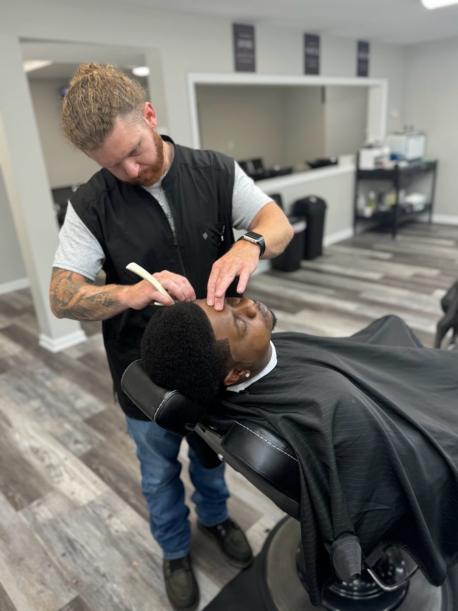 Hot-lather straight-razor shave in progress